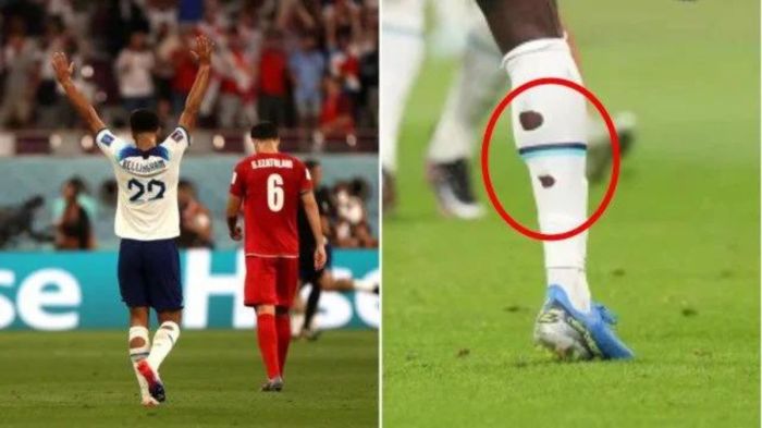 Why do pro footballers cut their socks?