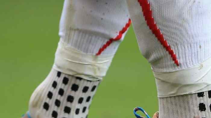Do rugby players cut their socks?