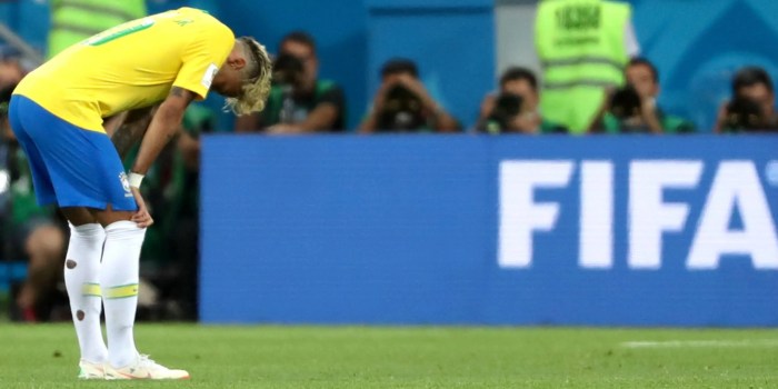 Why do pro footballers cut their socks?