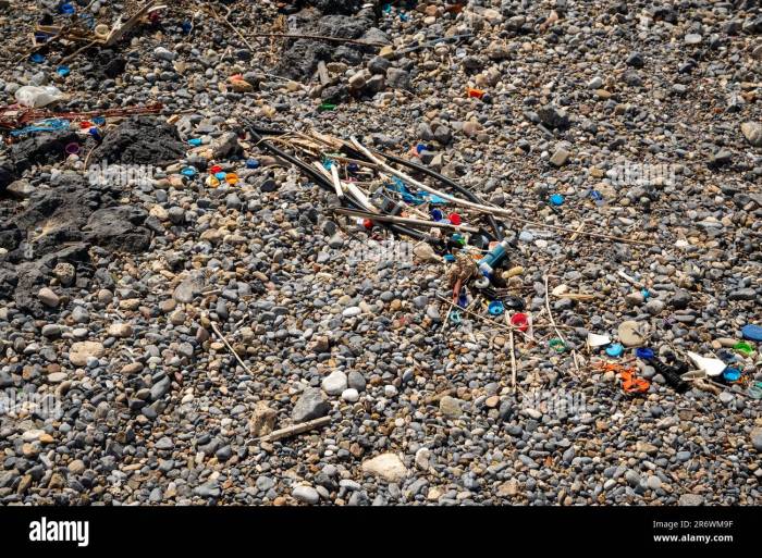 Washed up plastic waste (ocean plastic) on a beach polluting the oceans ... Oceans Awash in Plastic Waste