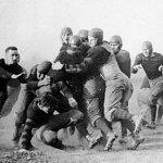 Why is 🏈 called football?