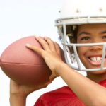 Can my son play football with glasses?