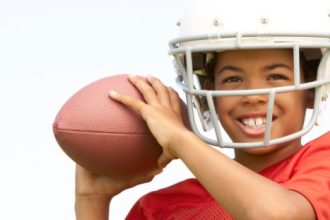 Can my son play football with glasses?