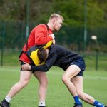 Is rugby a tackle or touch?